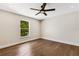 Spacious bedroom with hardwood floors and a ceiling fan at 1608 80Th Nw St, Bradenton, FL 34209