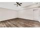 Large bedroom with hardwood floors and ceiling fan at 1608 80Th Nw St, Bradenton, FL 34209