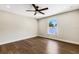 Bright bedroom featuring hardwood floors and a ceiling fan at 1608 80Th Nw St, Bradenton, FL 34209