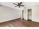 Hardwood floor bedroom with ceiling fan and closet at 1608 80Th Nw St, Bradenton, FL 34209