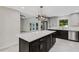 Modern kitchen with dark cabinetry and expansive island at 1608 80Th Nw St, Bradenton, FL 34209