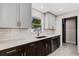 Sleek kitchen with stainless steel appliances and dark cabinets at 1608 80Th Nw St, Bradenton, FL 34209