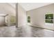 Sunlit living room with tile floors and large windows at 1608 80Th Nw St, Bradenton, FL 34209