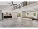 Two-story living room with open floor plan and modern kitchen at 1608 80Th Nw St, Bradenton, FL 34209