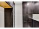 Well-organized pantry with dark wood cabinets and white countertops at 1608 80Th Nw St, Bradenton, FL 34209