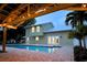 Inviting pool area with patio and string lights creating a relaxing ambiance at 1608 80Th Nw St, Bradenton, FL 34209