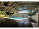 View of the pool and house from under the patio at 1608 80Th Nw St, Bradenton, FL 34209