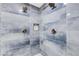 A large walk-in shower with double shower heads and blue tile at 1608 80Th Nw St, Bradenton, FL 34209