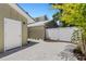 Gravel side yard with white fence and landscaping at 1608 80Th Nw St, Bradenton, FL 34209