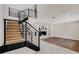 Modern open staircase with wood steps and metal railing at 1608 80Th Nw St, Bradenton, FL 34209