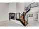 Modern staircase with metal railing and wooden steps at 1608 80Th Nw St, Bradenton, FL 34209