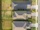 Top-down view of three houses, showing rooflines and landscaping at 16135 Paynes Mill Dr, Bradenton, FL 34211