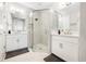 Elegant bathroom with double vanity and a large glass shower at 16135 Paynes Mill Dr, Bradenton, FL 34211