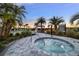 Relaxing hot tub surrounded by landscaping at 16135 Paynes Mill Dr, Bradenton, FL 34211