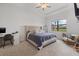 Bright bedroom with king-size bed and built-in workspace at 16439 Slate Pl, Bradenton, FL 34211