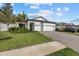 Modern two-car garage home with landscaped lawn at 16439 Slate Pl, Bradenton, FL 34211