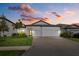 Attractive single-story home with a two-car garage and well-manicured lawn at 16439 Slate Pl, Bradenton, FL 34211