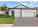 Modern two-car garage home with landscaped lawn at 16439 Slate Pl, Bradenton, FL 34211