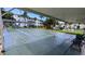 Community shuffleboard courts with benches and shade at 2036 Canal Dr # M33, Bradenton, FL 34207