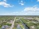 Aerial perspective showcasing the property's location and waterway access at 2146 Como St, Port Charlotte, FL 33948