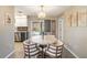 Dining area with a round table and four chairs, near the kitchen at 2146 Como St, Port Charlotte, FL 33948