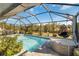 Resort-style pool and spa with screened enclosure, creating a private oasis at 2146 Como St, Port Charlotte, FL 33948