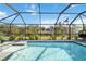 Inviting screened pool with a tranquil atmosphere and expansive backyard view at 2146 Como St, Port Charlotte, FL 33948