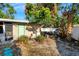 Mature landscaping and a stone pathway highlight this charming backyard at 2416 Amherst Ave, Bradenton, FL 34207