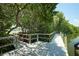 Wooden walkway and dock with mangrove trees at 2416 Amherst Ave, Bradenton, FL 34207