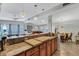 Granite countertop kitchen with breakfast bar and wood cabinets at 2416 Amherst Ave, Bradenton, FL 34207