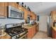 Kitchen with stainless steel appliances and wood cabinets at 2416 Amherst Ave, Bradenton, FL 34207