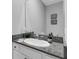 Modern bathroom with granite countertop, oval sink, and white cabinetry at 2471 Midnight Pearl Dr, Sarasota, FL 34240