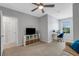 Bedroom with TV, workspace, and built-in shelving at 2471 Midnight Pearl Dr, Sarasota, FL 34240