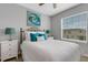 Bedroom with bed, nightstands, and window at 2471 Midnight Pearl Dr, Sarasota, FL 34240