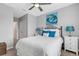 Bedroom with bed, nightstands, and ceiling fan at 2471 Midnight Pearl Dr, Sarasota, FL 34240