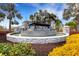 Attractive community entrance with a water feature and landscaping at 2471 Midnight Pearl Dr, Sarasota, FL 34240