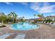 Large community pool surrounded by lounge chairs at 2471 Midnight Pearl Dr, Sarasota, FL 34240