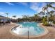 Inviting community pool with lounge chairs and palm trees at 2471 Midnight Pearl Dr, Sarasota, FL 34240