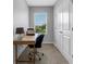 Home office with desk, chair, and window at 2471 Midnight Pearl Dr, Sarasota, FL 34240