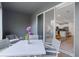 White patio table and chairs with view into the kitchen at 2471 Midnight Pearl Dr, Sarasota, FL 34240