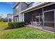 Relaxing screened patio with table and chairs, perfect for outdoor dining at 2471 Midnight Pearl Dr, Sarasota, FL 34240