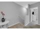 Upstairs hallway with carpet, white table, and view of bedroom at 2471 Midnight Pearl Dr, Sarasota, FL 34240