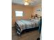 Bedroom with a full-size bed and ceiling fan at 2601 Gulf N Dr # 528, Bradenton Beach, FL 34217