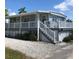 Single-story home with a large deck and white railings at 2601 Gulf N Dr # 528, Bradenton Beach, FL 34217