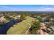 Aerial view of Sandhill community, showcasing homes and golf course at 3105 Sandleheath # 1, Sarasota, FL 34235