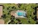 Aerial view of community pool and lush landscaping at 3105 Sandleheath # 1, Sarasota, FL 34235