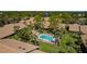 Community pool and surrounding buildings in an aerial view at 3105 Sandleheath # 1, Sarasota, FL 34235