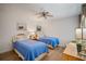 Guest bedroom with twin beds, wood floors and lots of natural light at 3105 Sandleheath # 1, Sarasota, FL 34235