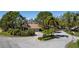 Sandhill community entrance with lush landscaping and flag at 3105 Sandleheath # 1, Sarasota, FL 34235