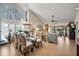 Bright dining room with glass-top table, wicker chairs, and chandelier at 3105 Sandleheath # 1, Sarasota, FL 34235